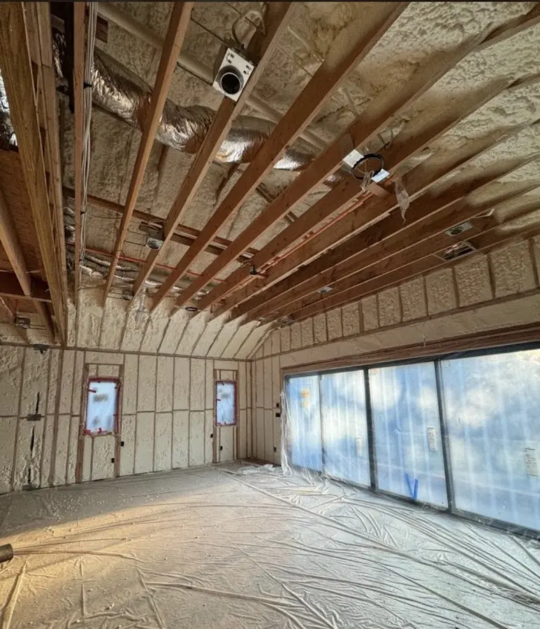 Interior walls and ceiling insulated with spray foam during new construction in Keansburg